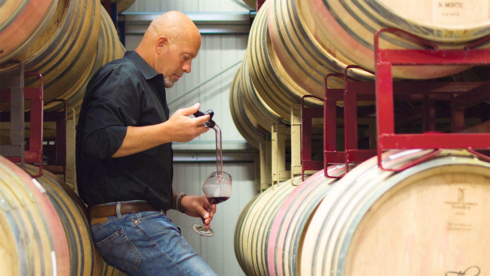 James MacPhail tastes Pinot Noir from the barrel during his work at The Calling winery.